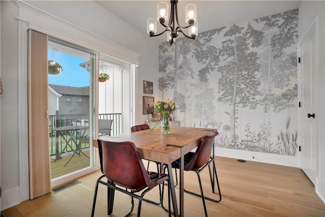 2630 N Gulley Grove Cir, Fayetteville, AR 72703 - dining room with light wood-style flooring and a chandelier