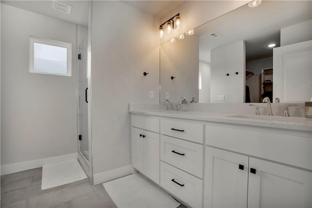 2630 N Gulley Grove Cir, Fayetteville, AR 72703 - full bath with a stall shower, double vanity, baseboards, and a spacious closet