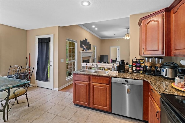 kitchen with stainless steel dishwasher, a sink, a peninsula, a ceiling fan, and light tile patterned flooring