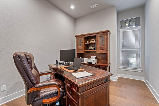 office space with light wood finished floors, baseboards, and recessed lighting