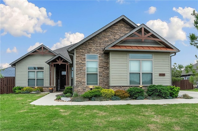 craftsman inspired home featuring stone siding, a standing seam roof, and metal roof