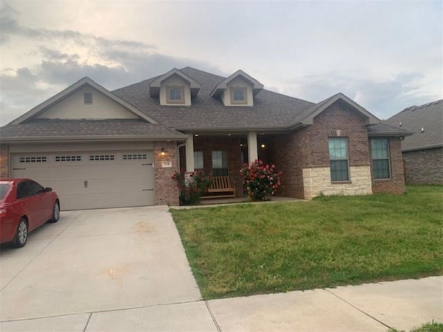 214 Hunt St, Pea Ridge, AR 72751 - view of front of house with brick siding, an attached garage, a front yard, concrete driveway, and a porch