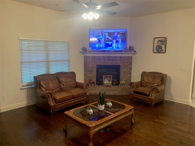 214 Hunt St, Pea Ridge, AR 72751 - living area with wood finished floors, a ceiling fan, baseboards, and a brick fireplace