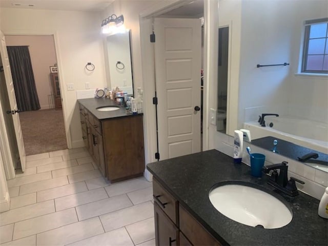 214 Hunt St, Pea Ridge, AR 72751 - full bathroom with tile patterned floors, two vanities, and a garden tub