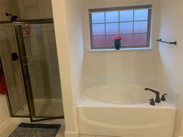 214 Hunt St, Pea Ridge, AR 72751 - bathroom featuring a stall shower, a garden tub, and tile patterned floors