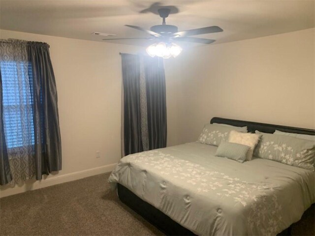 214 Hunt St, Pea Ridge, AR 72751 - carpeted bedroom with baseboards and a ceiling fan