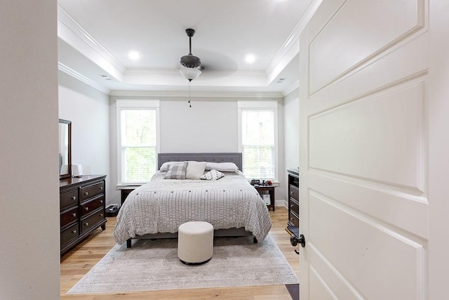 29 Salen Ln, Bella Vista, AR 72715 - bedroom with light wood finished floors, multiple windows, crown molding, a raised ceiling, and a ceiling fan