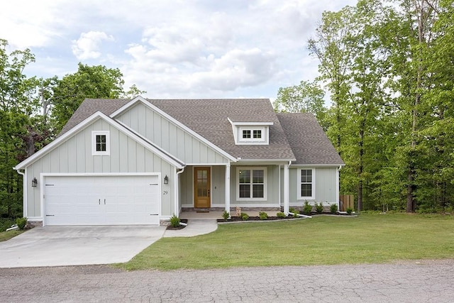 29 Salen Ln, Bella Vista, AR 72715 - view of front of home with concrete driveway, a garage, a front lawn, roof with shingles, and covered porch