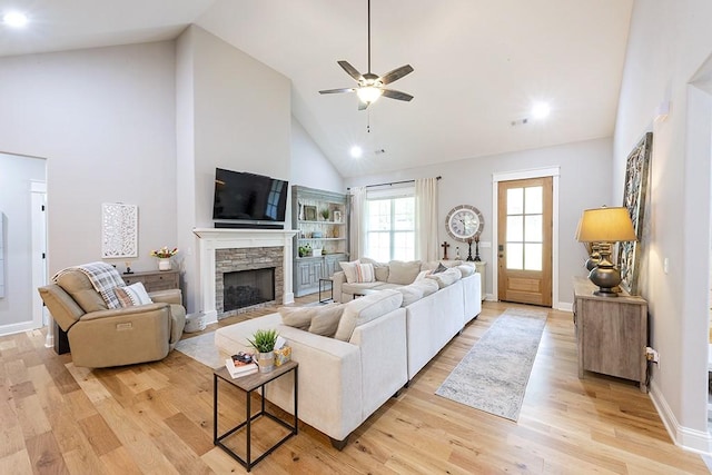 29 Salen Ln, Bella Vista, AR 72715 - living room with high vaulted ceiling, a ceiling fan, a fireplace, light wood-style flooring, and recessed lighting