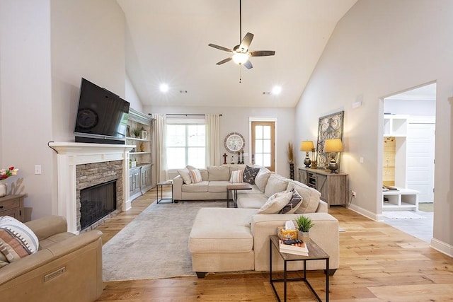 29 Salen Ln, Bella Vista, AR 72715 - living room with a ceiling fan, high vaulted ceiling, a fireplace, light wood-style flooring, and baseboards
