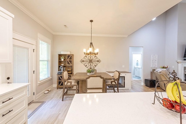 29 Salen Ln, Bella Vista, AR 72715 - dining space with a chandelier, light wood-style flooring, baseboards, and ornamental molding