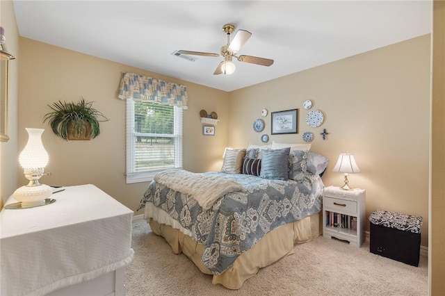 bedroom featuring carpet flooring, a ceiling fan, and baseboards