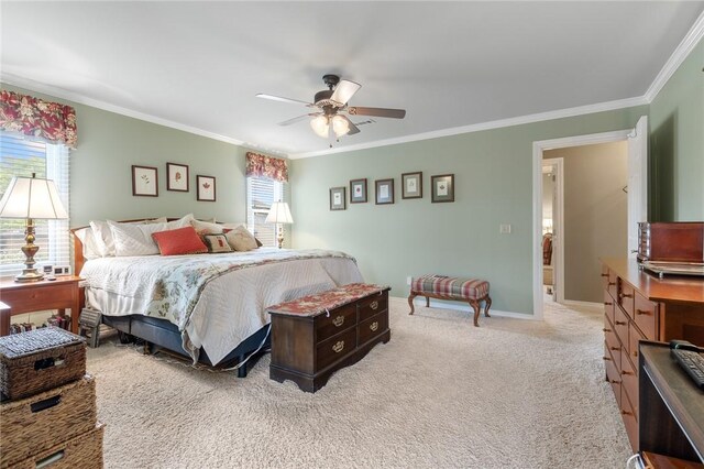 bedroom with ornamental molding, carpet floors, ceiling fan, and baseboards