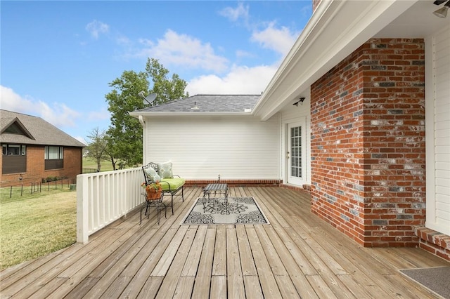 wooden terrace featuring outdoor lounge area and a yard