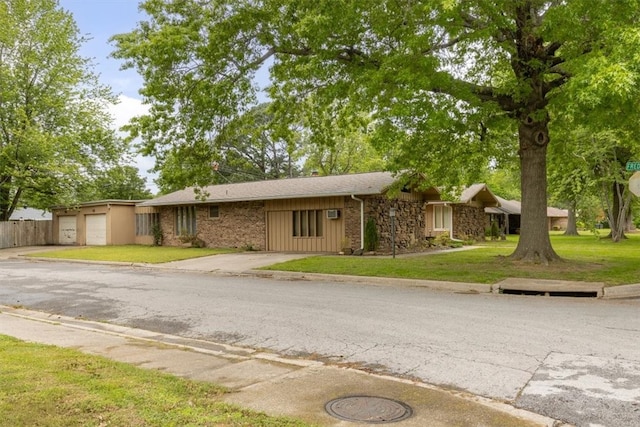 410 Harve St, Springdale, AR 72762 - view of front of home featuring a front yard, driveway, a garage, and brick siding