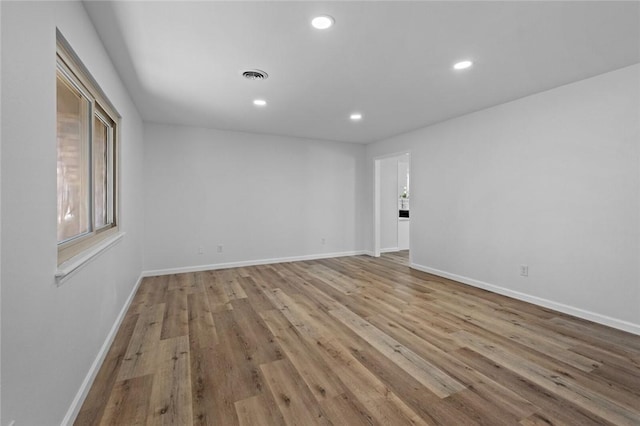 1104 S 12th St, Rogers, AR 72756 - spare room featuring recessed lighting, wood finished floors, and baseboards