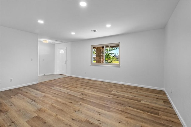 1104 S 12th St, Rogers, AR 72756 - unfurnished living room with wood finished floors, recessed lighting, and baseboards