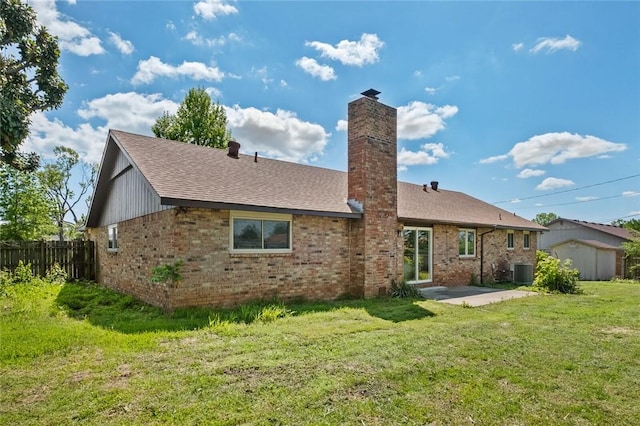 1104 S 12th St, Rogers, AR 72756 - back of house with a patio area, roof with shingles, a chimney, and brick siding