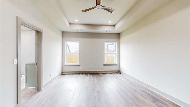181 Magazine, Prairie Grove, AR 72753 - empty room featuring ceiling fan, light wood-style flooring, a tray ceiling, and baseboards