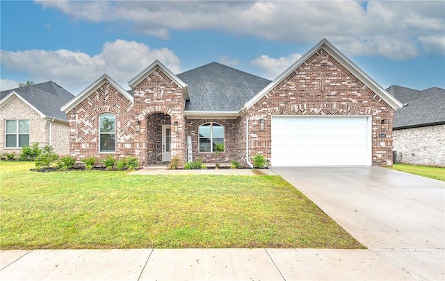 view of front of home with brick siding, an attached garage, a front lawn, roof with shingles, and concrete driveway