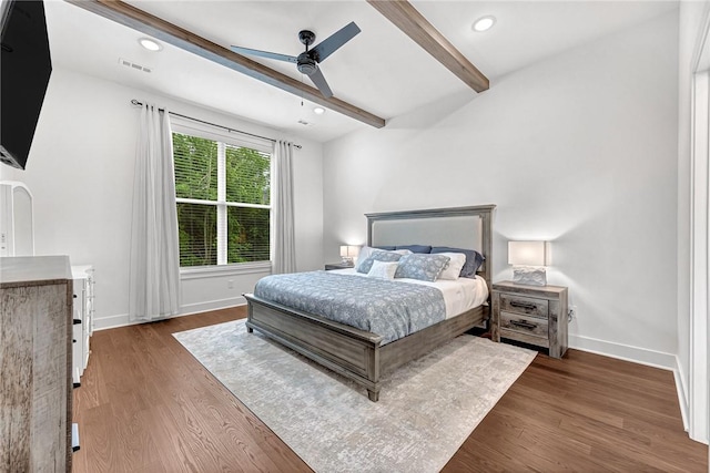 bedroom with beamed ceiling, wood finished floors, baseboards, a ceiling fan, and recessed lighting