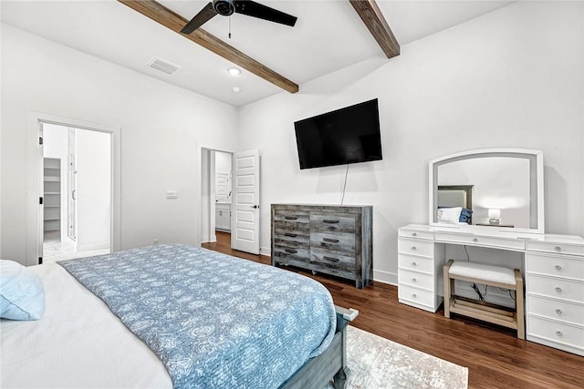 bedroom featuring beam ceiling, wood finished floors, a ceiling fan, and baseboards