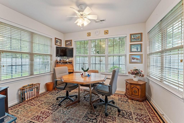 office area featuring baseboards and ceiling fan