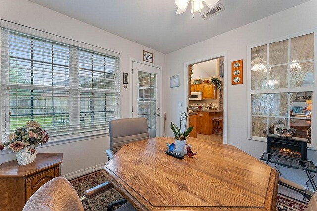 dining space featuring ceiling fan