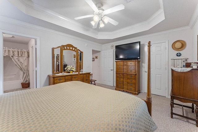 bedroom with a tray ceiling, ornamental molding, carpet flooring, and ceiling fan