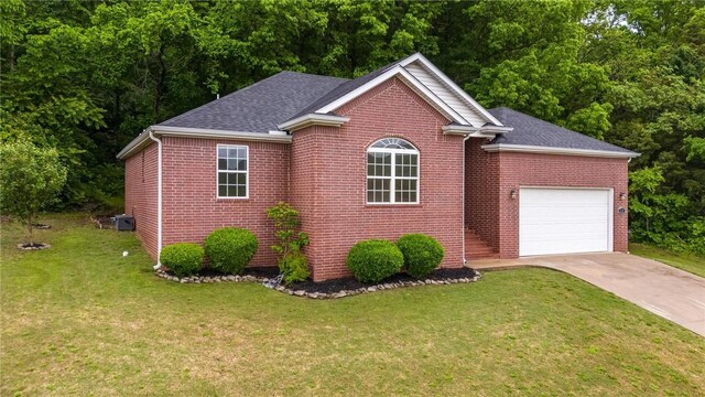 701 W Thornstone Ave, West Fork, AR 72774 - view of front of house with concrete driveway, an attached garage, brick siding, a front yard, and a shingled roof
