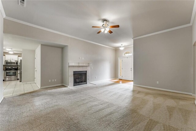 701 W Thornstone Ave, West Fork, AR 72774 - unfurnished living room featuring light carpet, ceiling fan, baseboards, a tiled fireplace, and ornamental molding