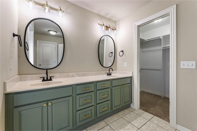 701 W Thornstone Ave, West Fork, AR 72774 - bathroom with tile patterned floors, double vanity, a spacious closet, and baseboards