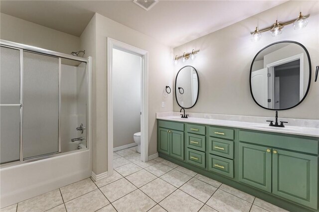 701 W Thornstone Ave, West Fork, AR 72774 - full bath with toilet, double vanity, tile patterned flooring, and enclosed tub / shower combo
