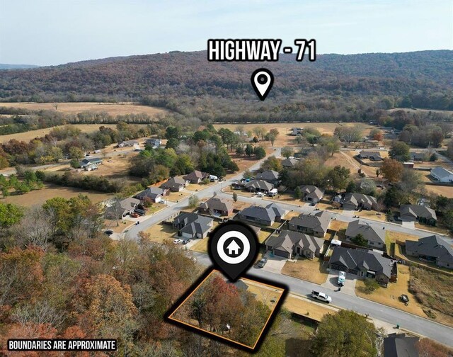 701 W Thornstone Ave, West Fork, AR 72774 - aerial overview of property's location featuring property boundaries highlighted, nearby suburban area, and a forest