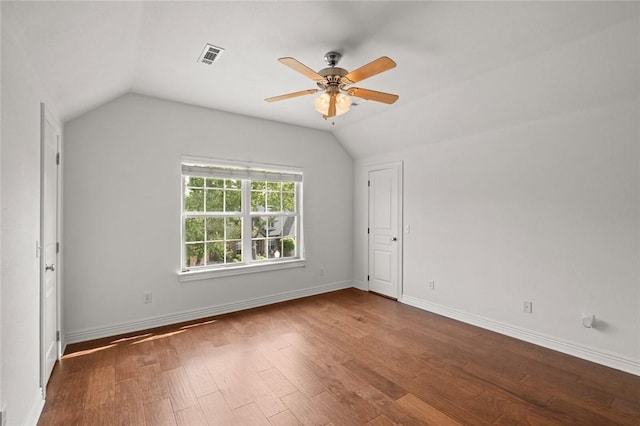 3907 NE Cadbury Ave, Bentonville, AR 72712 - unfurnished room with vaulted ceiling, a ceiling fan, wood finished floors, and baseboards