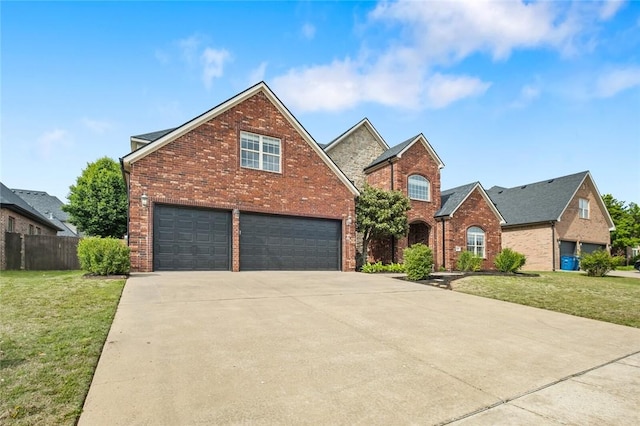 3907 NE Cadbury Ave, Bentonville, AR 72712 - traditional-style house featuring brick siding, concrete driveway, and a garage