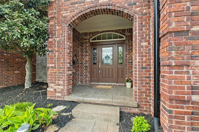 3907 NE Cadbury Ave, Bentonville, AR 72712 - doorway to property featuring brick siding