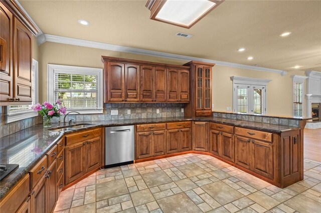 3907 NE Cadbury Ave, Bentonville, AR 72712 - kitchen with stainless steel dishwasher, a sink, ornamental molding, light stone finish floors, and recessed lighting