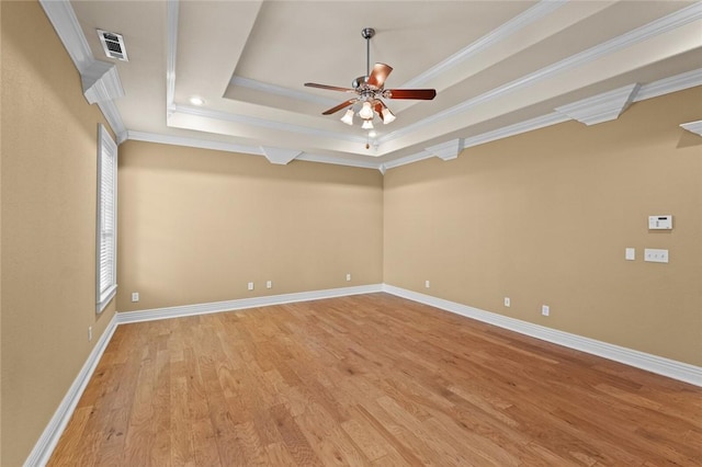 3907 NE Cadbury Ave, Bentonville, AR 72712 - unfurnished room with light wood-style floors, a ceiling fan, ornamental molding, a tray ceiling, and baseboards