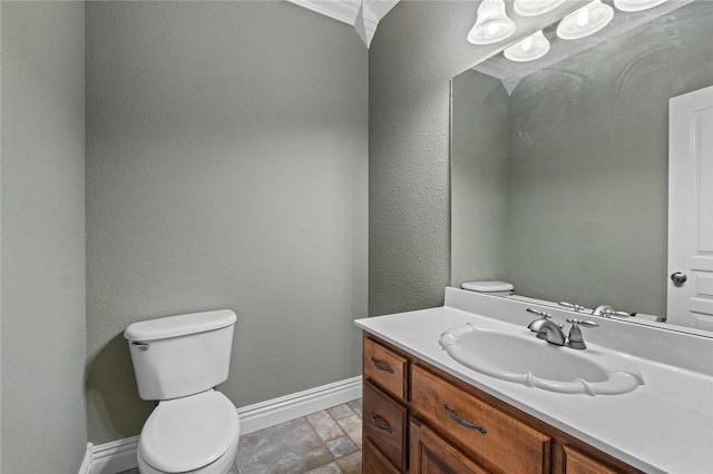 3907 NE Cadbury Ave, Bentonville, AR 72712 - half bath featuring toilet, baseboards, vanity, and stone finish floors