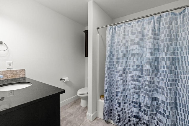 6005 Sherman St, Bentonville, AR 72713 - bathroom featuring vanity, curtained shower, tile patterned flooring, toilet, and baseboards