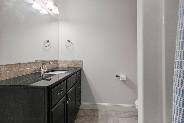 6005 Sherman St, Bentonville, AR 72713 - bathroom featuring vanity, toilet, and baseboards
