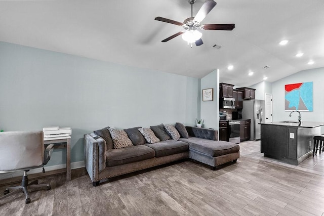 6005 Sherman St, Bentonville, AR 72713 - living area with light wood-style floors, a ceiling fan, vaulted ceiling, recessed lighting, and baseboards