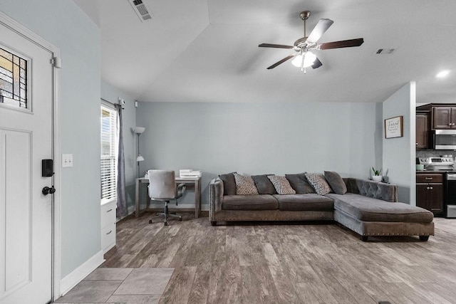 6005 Sherman St, Bentonville, AR 72713 - living area with wood finished floors, ceiling fan, vaulted ceiling, baseboards, and an office area