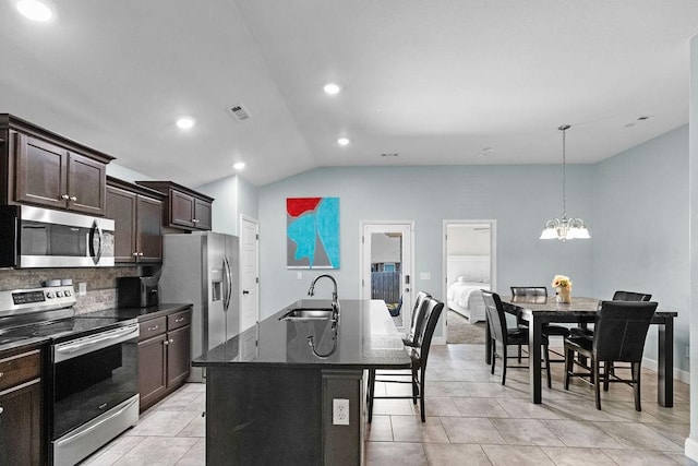 6005 Sherman St, Bentonville, AR 72713 - kitchen featuring stainless steel appliances, a sink, vaulted ceiling, dark brown cabinetry, and a chandelier