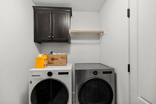 6005 Sherman St, Bentonville, AR 72713 - laundry area featuring washing machine and dryer and cabinet space