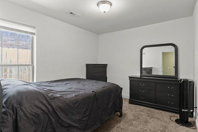 6005 Sherman St, Bentonville, AR 72713 - carpeted bedroom with baseboards