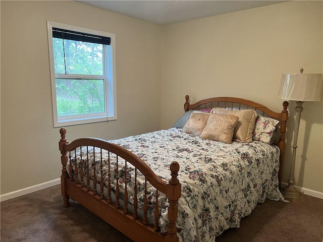 bedroom featuring baseboards and carpet flooring
