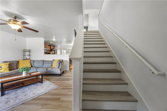 4208 SW Fieldstone Blvd, Bentonville, AR 72712 - staircase featuring a ceiling fan, wood finished floors, and recessed lighting