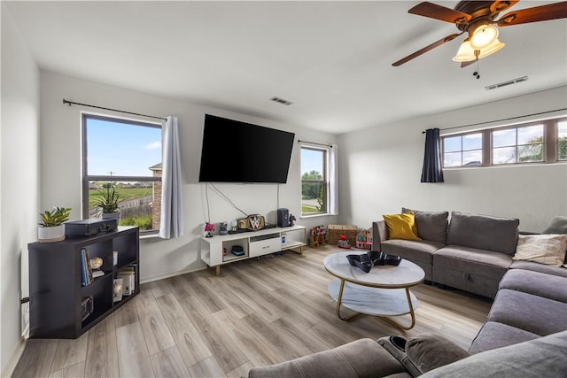 4208 SW Fieldstone Blvd, Bentonville, AR 72712 - living area featuring healthy amount of natural light, a ceiling fan, and light wood finished floors